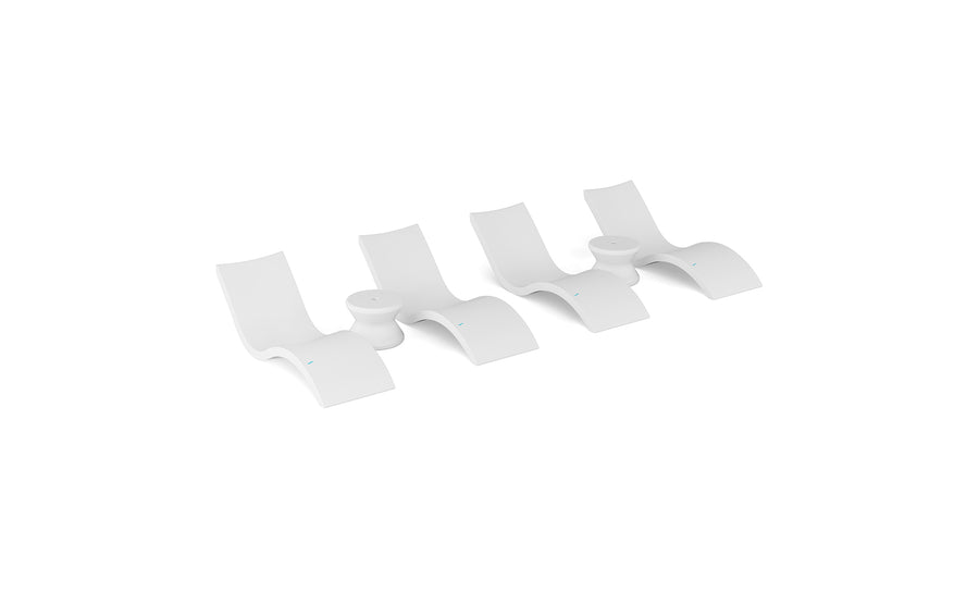 The Ledge Lounger Signature Chaise and Side Table In-Pool 6-Piece Set features modern white, wave-inspired loungers stylishly arranged on a plain background, highlighting chic pool ledge furniture.