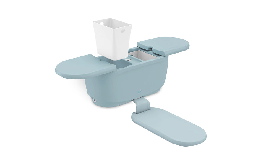 The Ledge Lounger PartyPad Swim-Up Bar is ideal for poolside relaxation. With its light blue exterior and white inner container, plus an extended lid and attached footrest, this compact, modern design brings chic style to any outdoor oasis.