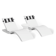 The Ledge Lounger Adjustable Chaise with Pillows and Side Table In-Pool & Patio Set features two modern white chaises with black and white striped pillows, plus a sleek side table—ideal for contemporary outdoor spaces.