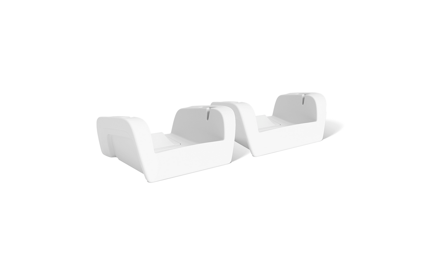 Upgrade Your Signature Chaise Armrest Console 2pk by Ledge Lounger features two identical white plastic brackets with a curved design, each sporting a slot and small protrusion on the inner edge. Shown side by side on a plain white background.