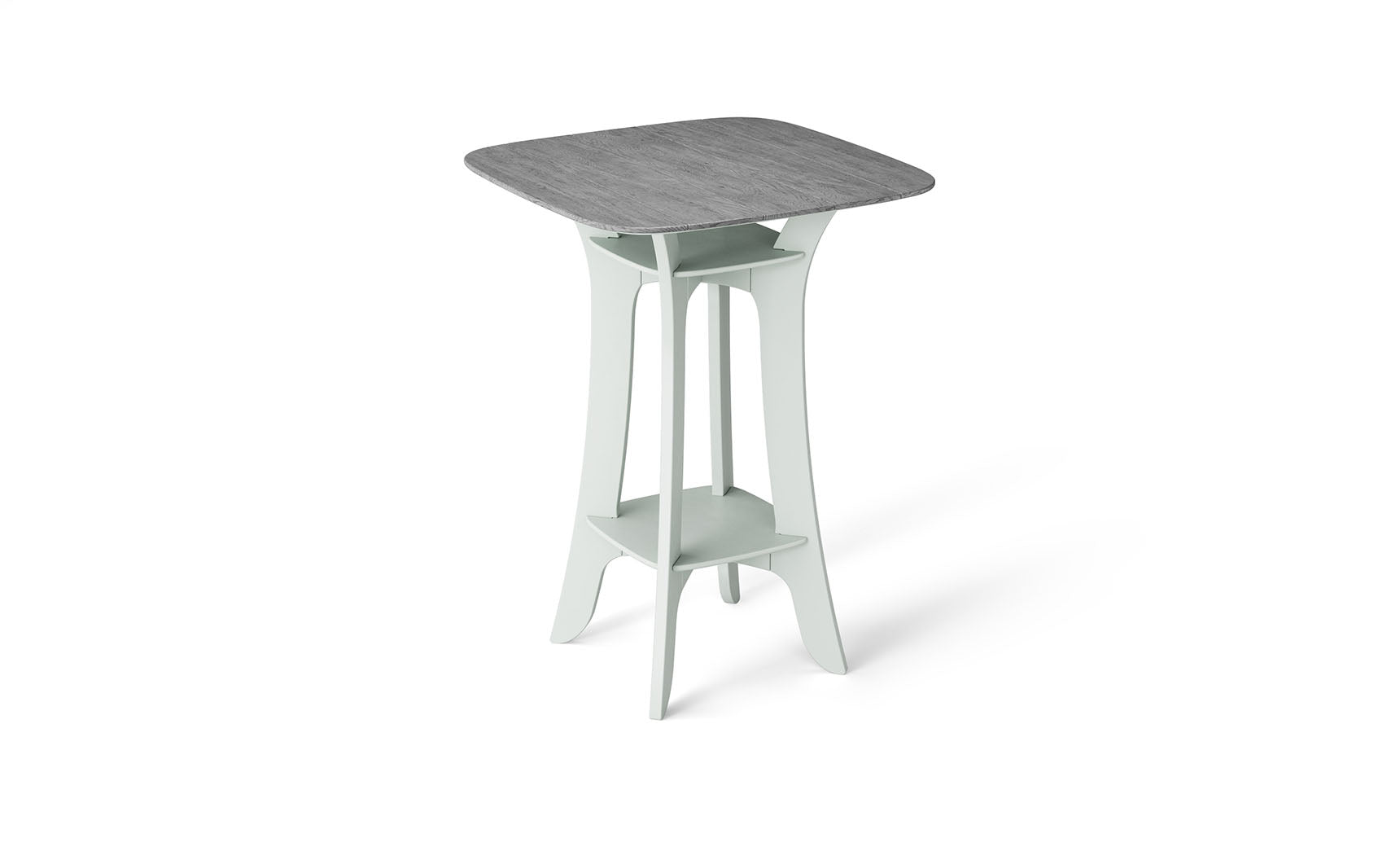 The Haven Hightop Table by Ledge Lounger is a modern square table with a grey top and light green, ergonomically curved legs. It features a small shelf below the tabletop, offering unique style and functionality as part of our patio collection.