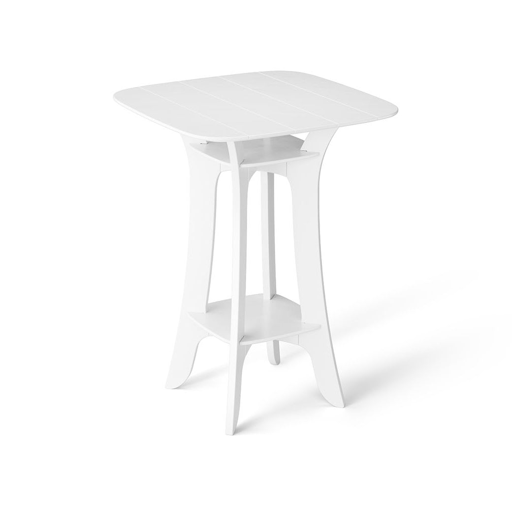 The Haven Hightop Table by Ledge Lounger is a white, rectangular plastic table with a smooth top, four curved legs, and a central support that forms an open geometric shape. Part of our patio collection, its durable design complements the all-white color scheme.