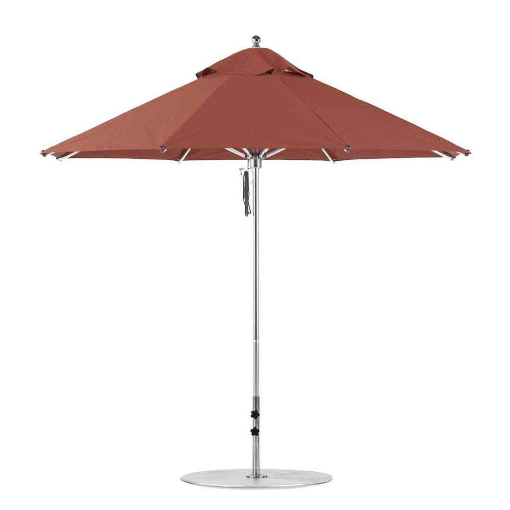 The Ledge Lounger Premier Aluminum Umbrella - 9 Octagon Pulley, in red, features a sturdy central pole and metal base. Its large canopy ensures shade with vented sections for airflow. Made from marine-grade fabrics, this wind-resistant umbrella is perfect for any outdoor patio setting.