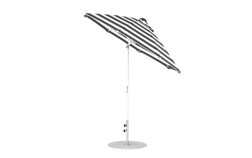 The Essential Fiberglass Umbrella by Ledge Lounger is a stylish 7.5 octagon crank auto tilt model with black and white stripes, marine-grade fabrics, and a sturdy metal pole and base, set against a plain white background.
