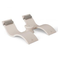 The Ledge Lounger Outdoor Paradise In-Pool Furniture Bundle features a minimalistic, light gray, dual arch-shaped yoga support prop with cushioned pads resembling two backrests joined in the center, ideal for creating an outdoor paradise against a plain white background.