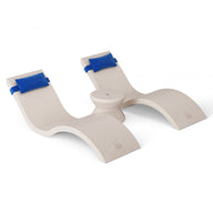 The Outdoor Paradise In-Pool Furniture Bundle by Ledge Lounger includes two beige, S-shaped plastic supports featuring blue padding on top. These symmetrical pieces securely hold items in place, likely for storage or display, and are sturdy yet lightweight against a white background.