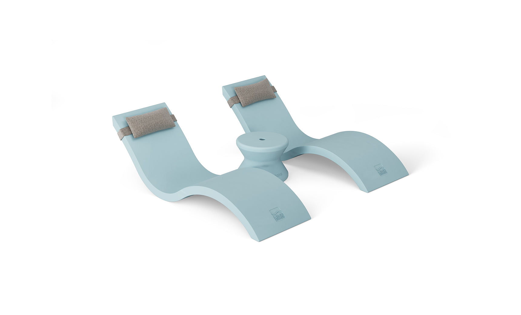 The Ledge Lounger Outdoor Paradise In-Pool Furniture Bundle includes a light blue ergonomic footrest with a double curved design and small round base. Two cushioned pads on each side add comfort, ideal for poolside relaxation. The piece is shown on a plain white backdrop.