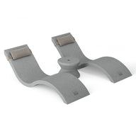 The Outdoor Paradise In-Pool Furniture Bundle by Ledge Lounger, shown against a white background, is a gray U-shaped prop with soft padding and upward-curved arms, offering versatile support for exercises or stretching. Its minimalist design evokes sleek pool ledge furniture.