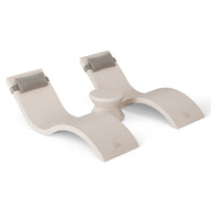 The white ergonomic knee rest from the Outdoor Paradise In-Pool Furniture Bundle by Ledge Lounger features curved design with gray-cushioned supports for comfort. The central part rises for stability and support, providing a luxurious feel similar to in-pool chaise loungers.