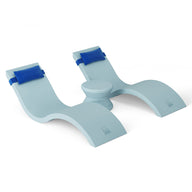 A light blue, S-shaped plastic book holder with curved supports connected by a circular brace is ideal for poolside reading. Blue straps secure your book on an in-pool chaise lounger by Ledge Lounger, from the Outdoor Paradise In-Pool Furniture Bundle. Background: white.