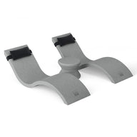 A gray, double-arched laptop stand with top black rubber grips, designed to hold and elevate devices. Its minimalist style mirrors Ledge Loungers Outdoor Paradise In-Pool Furniture Bundle with a central raised section for support and modern elegance.