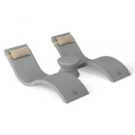 A gray yoga block with curved sides and central support, featuring beige padded ends, offers varied support and alignment options for exercises and mimics the Outdoor Paradise In-Pool Furniture Bundle by Ledge Lounger.