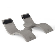 The Ledge Lounger Footrest, part of the Outdoor Paradise In-Pool Furniture Bundle, is a gray U-shaped ergonomic support with curved ends and black straps. It features a textured surface and central pivot for stability on any flat surface, ideal for elevating your feet in comfort.