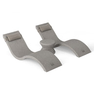 The Ledge Lounger Outdoor Paradise In-Pool Furniture Bundle includes a modern, gray double lounge chair with a curved design, built-in headrests, and a central round table. Ideal for pool ledge furniture.