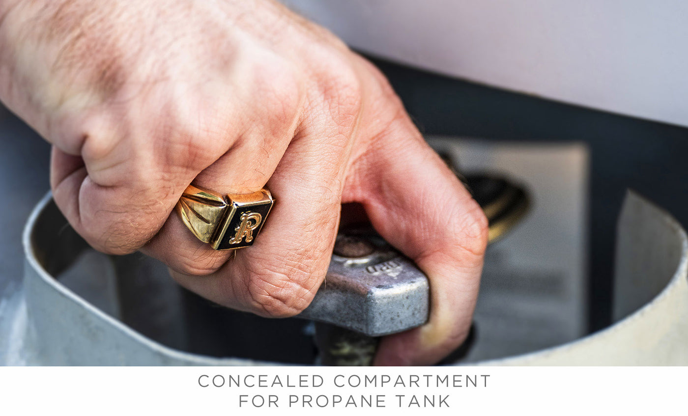 A hand wearing a gold ring turns a valve in the concealed compartment of a propane tank. Captioned, Halo Aglow Bundle by Ledge Lounger.