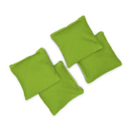 Four small, square green Bean Bags by Ledge Lounger are arranged loosely together on a white background.