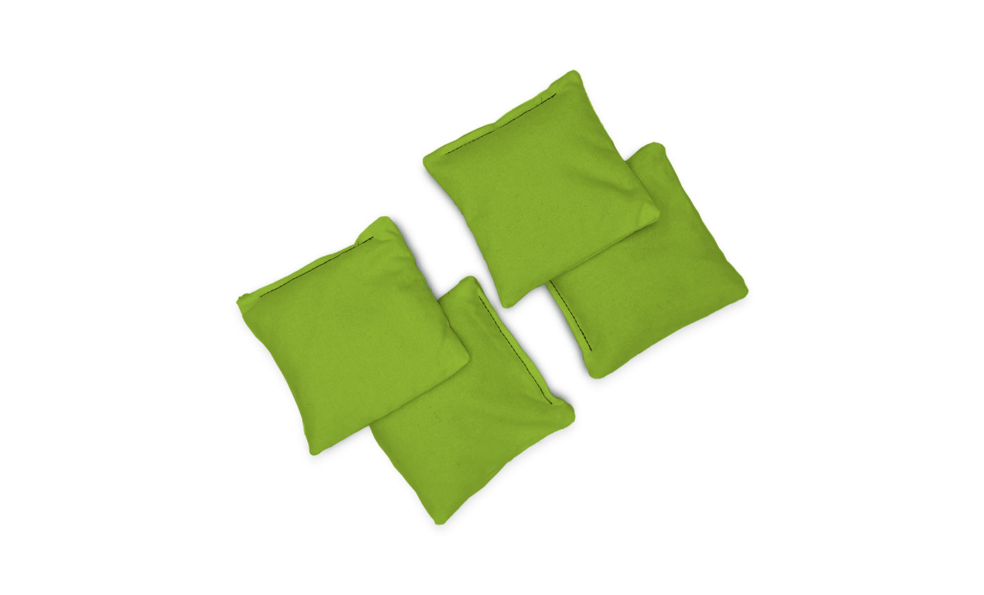 Four small, square green Bean Bags by Ledge Lounger are arranged loosely together on a white background.
