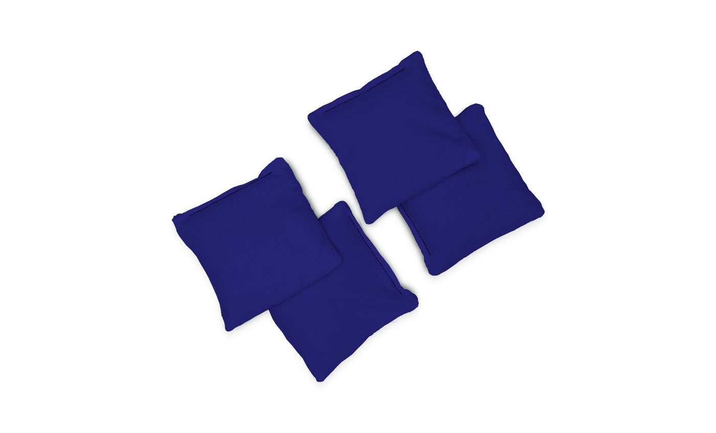 Four dark blue Ledge Lounger Bean Bags are arranged in a loose cluster on a white background, viewed from above.