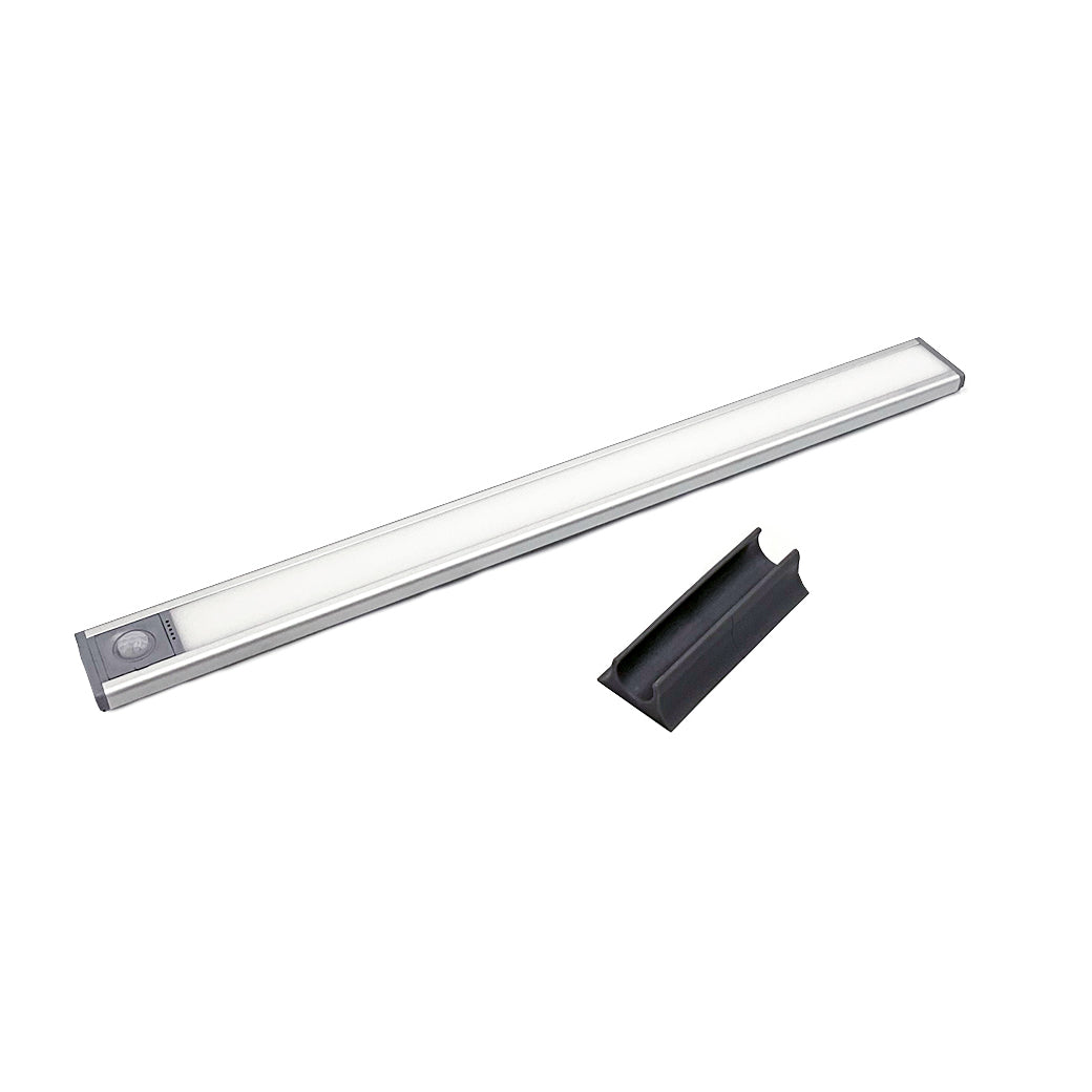 The Ledge Lounger Umbrella Light, a slim rectangular LED with a silver border and round button, comes with a detachable black mounting clip—ideal for illuminating your patio.