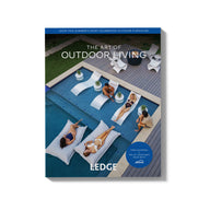 A cover from the 2026 Catalog by Ledge Lounger, titled “The Art of Outdoor Living,” features people relaxing on partially submerged lounge chairs and a pool deck, surrounded by modern outdoor furniture. The Ledge Lounger brand name is displayed at the bottom.