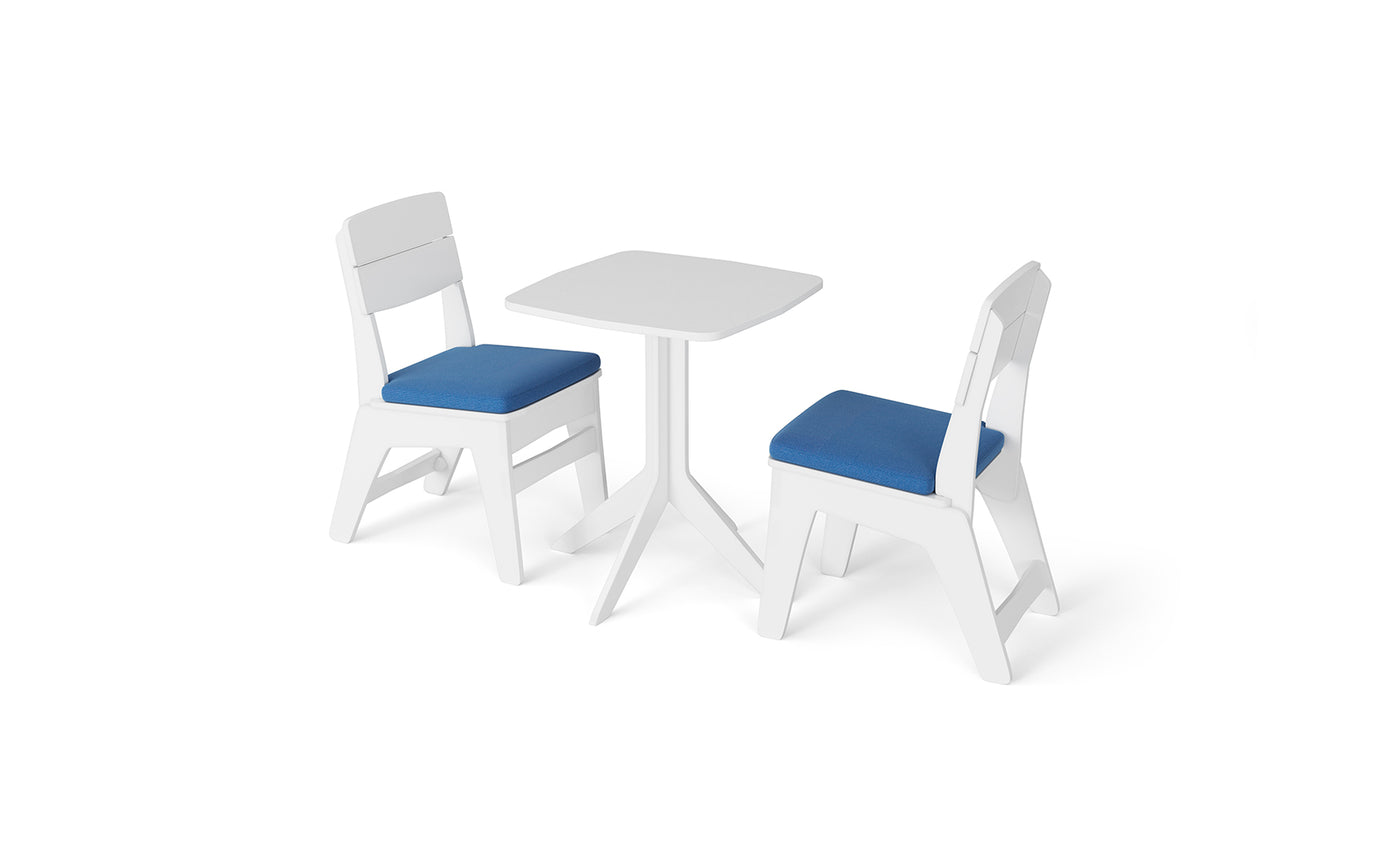 Introducing the Ledge Lounger New Combo: This stylish set features two white chairs with plush blue cushions paired with a sleek, small white square table, all beautifully presented on a pristine white background.