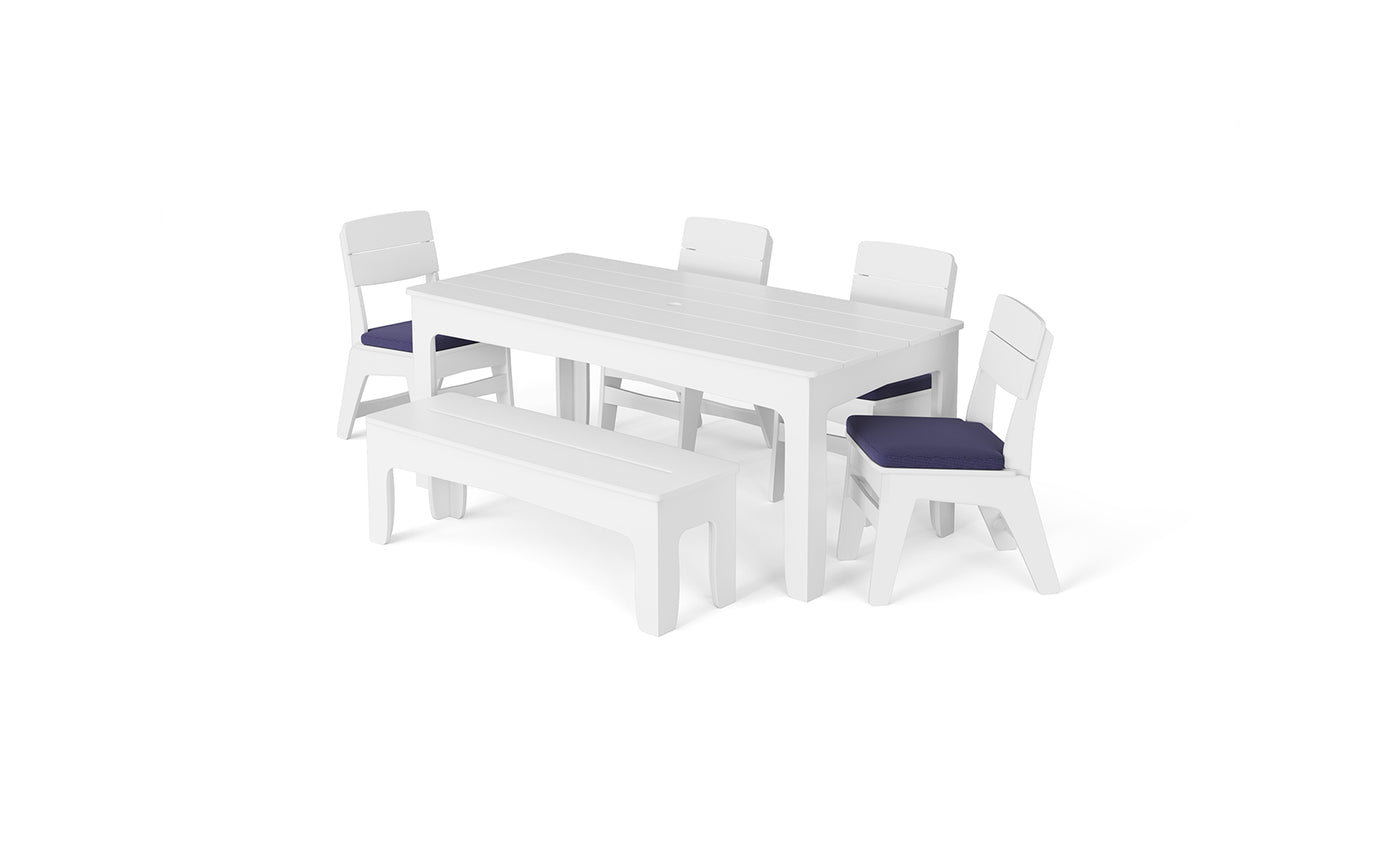 Introducing the Ledge Lounger New Combo: This stylish dining set includes a rectangular table, three chairs with rich dark blue seat cushions, and a matching bench, all beautifully showcased against a crisp white background.