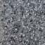 Close-up of a speckled granite surface, featuring a mix of gray, white, and black minerals. The textured pattern is uneven, with various shapes and sizes of mineral deposits distributed across the stone. color swatch
